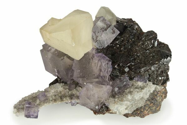 Purple, cubic fluorite associated with sphalerite and calcite from the Elmwood Mine.